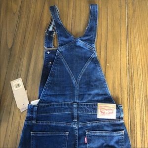 Levi’s skinny leg overalls dark wash